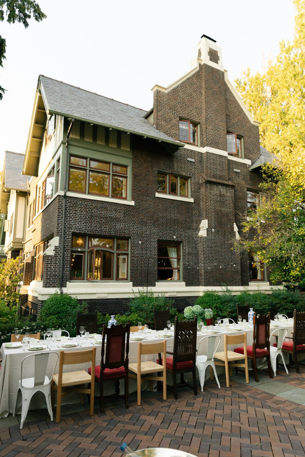 The Baillie's exterior architecture, with the table set in the courtyard below