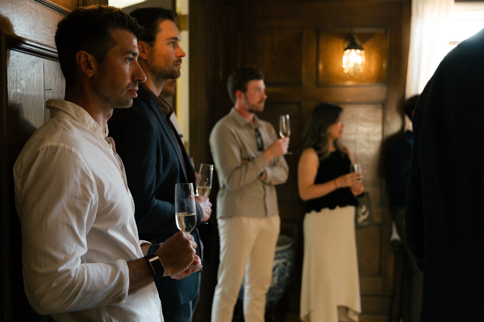 Guests standing with drinks during the evening