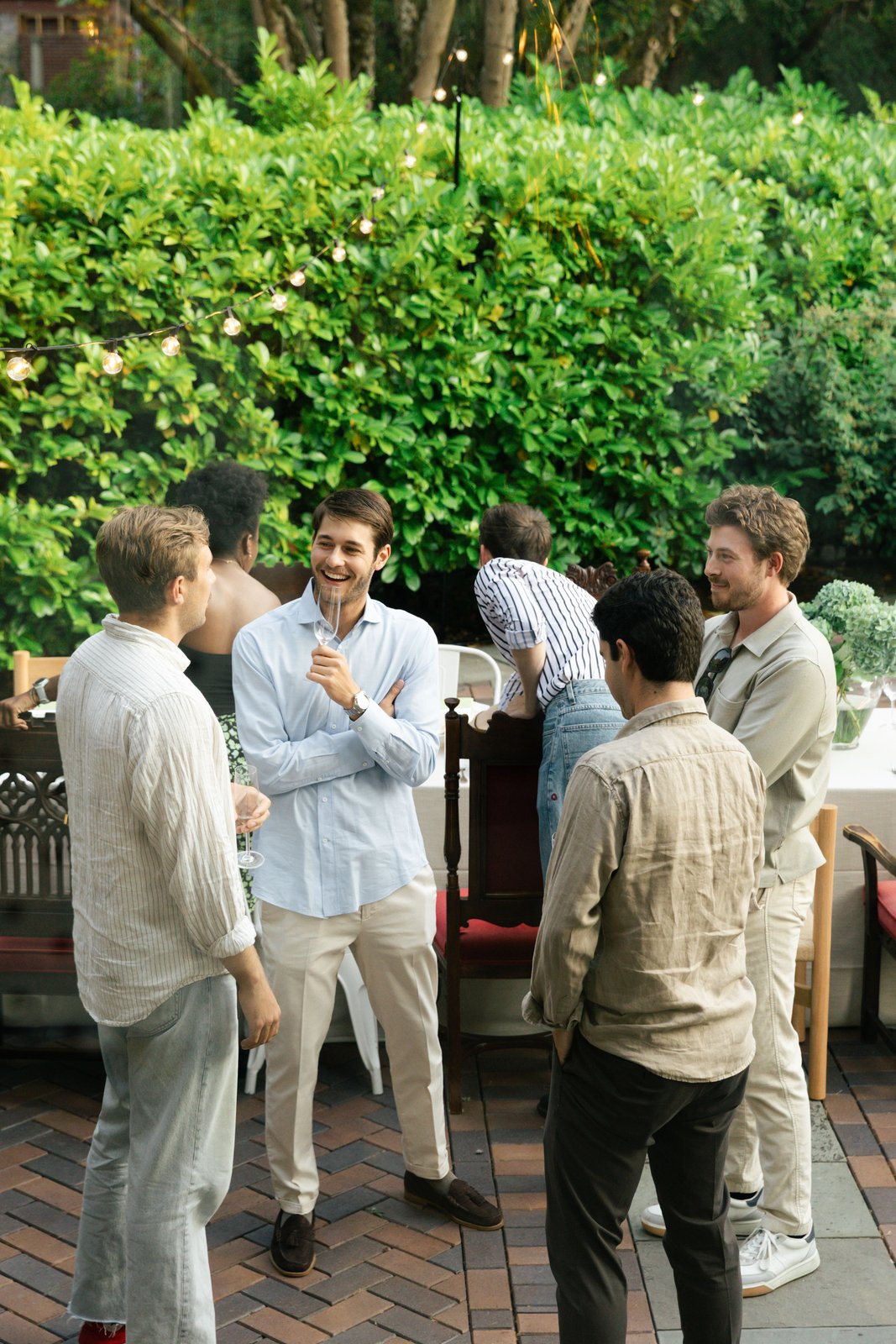 Guests gathered in conversation on the patio